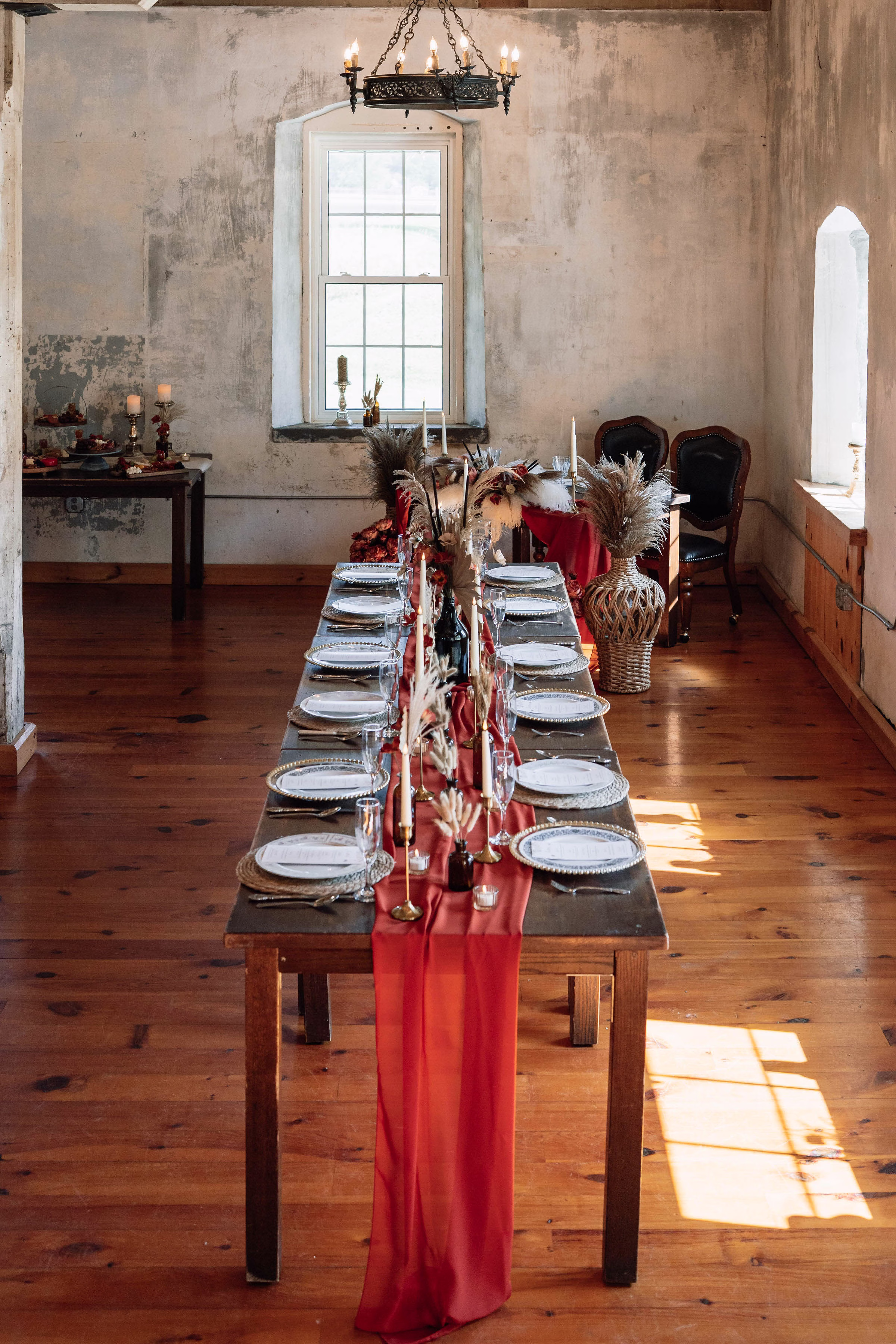 Rustic indoor reception table setup at The Mill on Rush Creek historic wedding venue in Rushford, Minnesota
