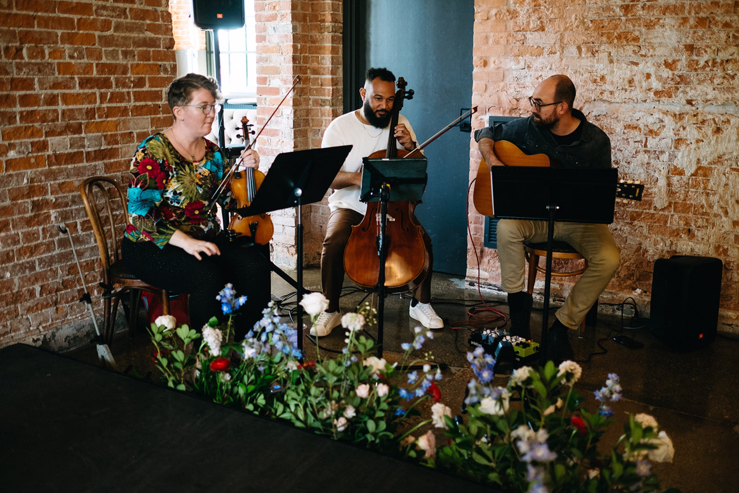 string quartet, Freegrass Trio, plays at a Hatchery Riverside