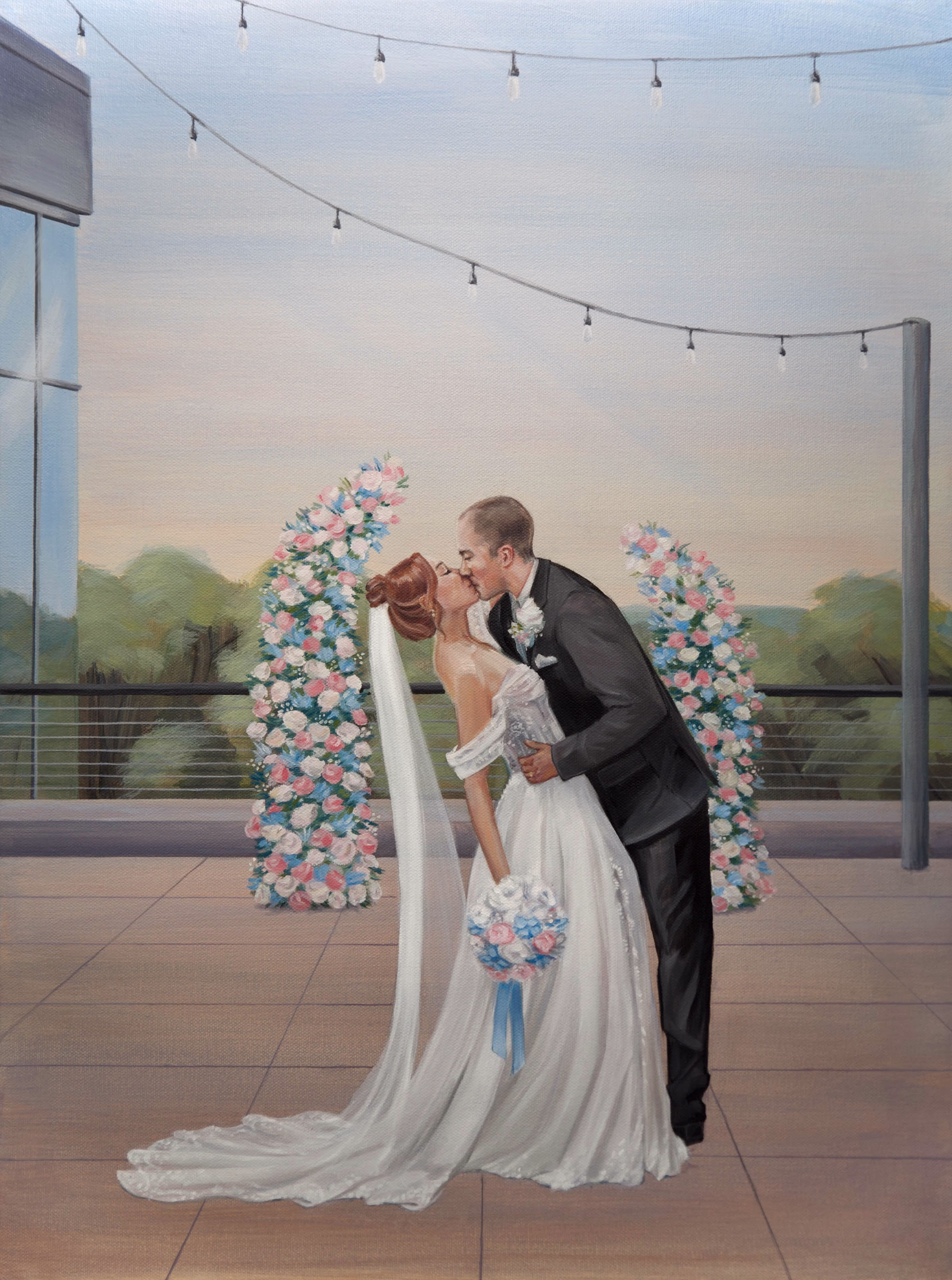 A finished live wedding painting by The Artist Brenda Berg, depicting a bride and groom kissing during an outdoor ceremony on a tiled terrace. The groom bends over to kiss the bride, who leans back in an off-the-shoulder white wedding gown with a long veil, holding a bouquet accented with blue and pink flowers. They stand between two matching floral pillars under a string of patio lights, with green trees and a soft sunset sky in the background.