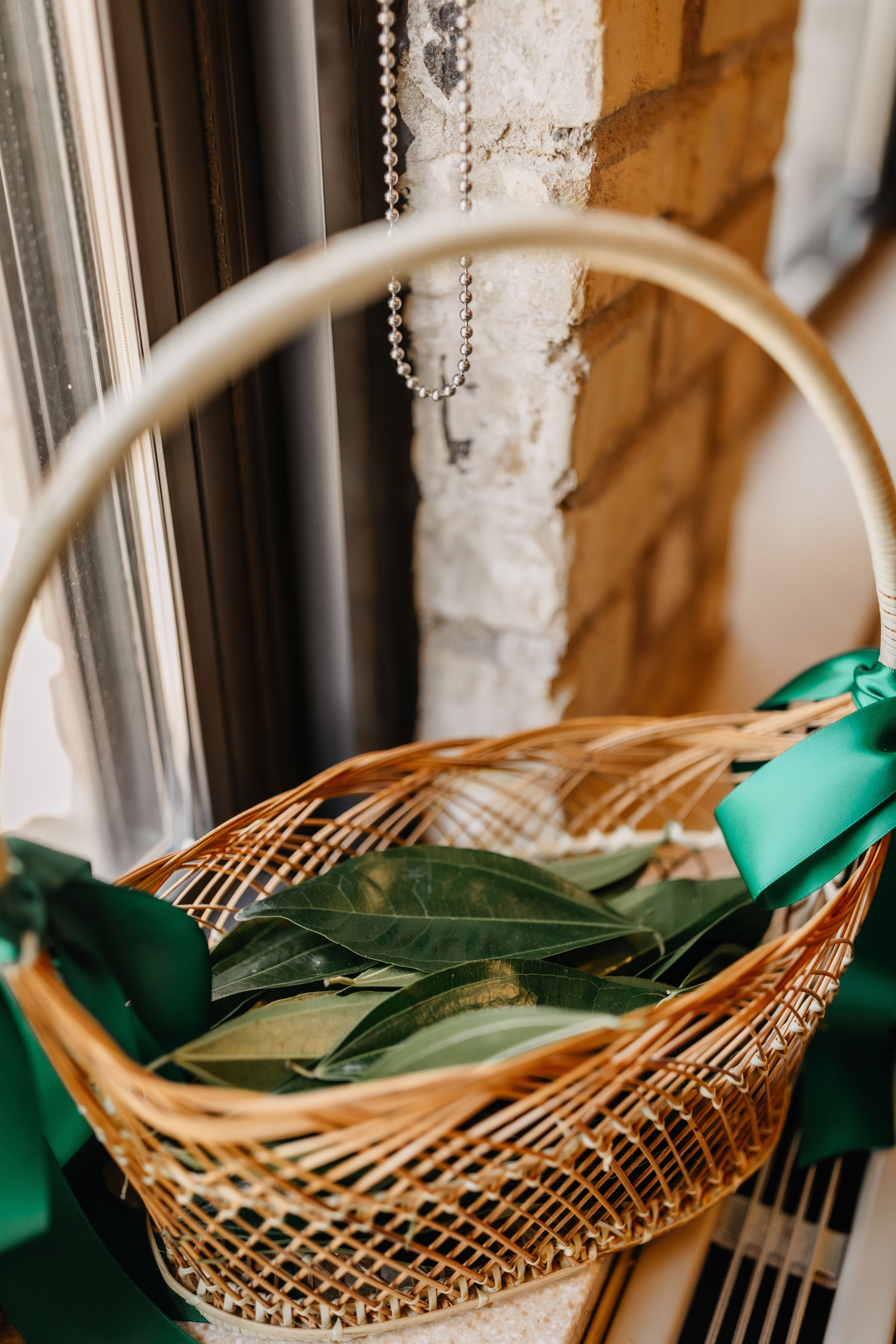instead of flowers, the couple chose to have leaves scattered down the aisle. They are pictured in a basket