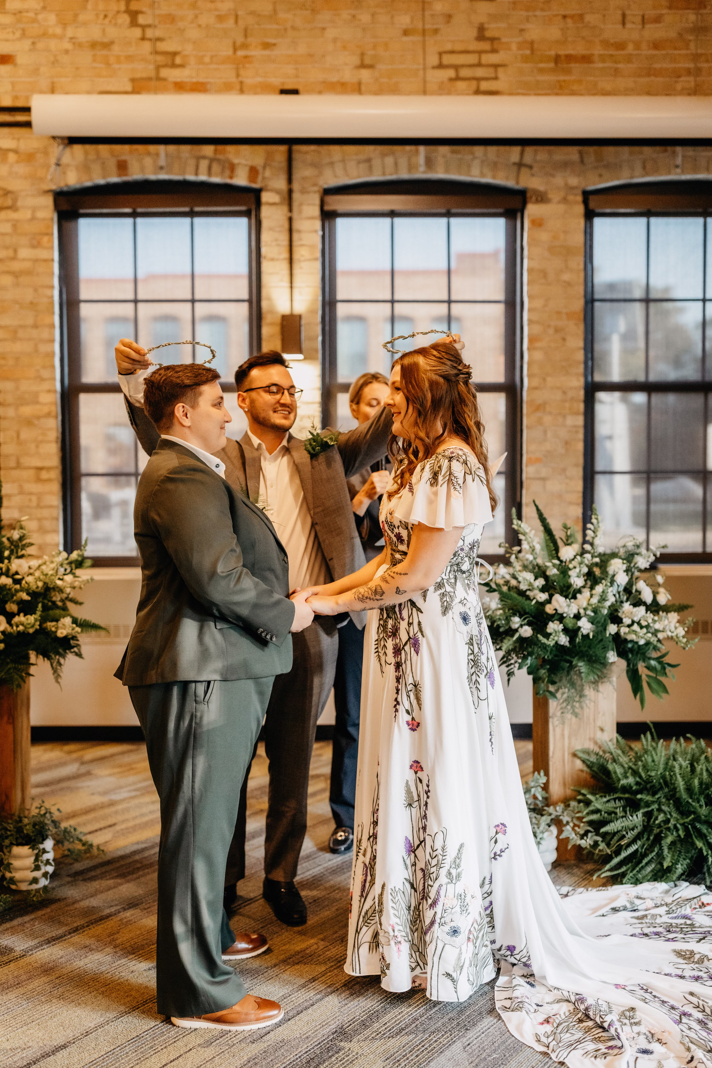 the officiant places crowns on Sam & Janine's heads, a symbol of unity in Greek tradition