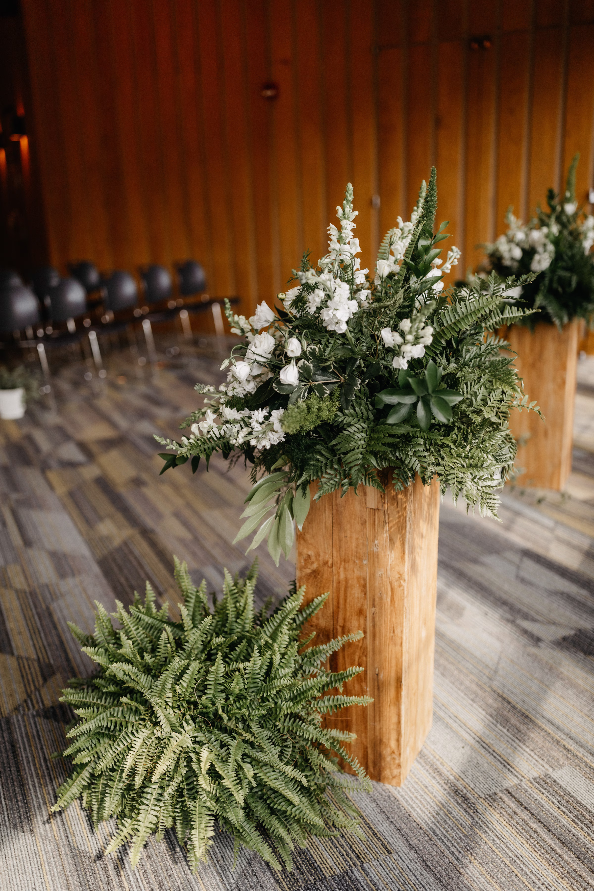 a detail photo of the ceremony florals and greenery by Melody Rose Designs