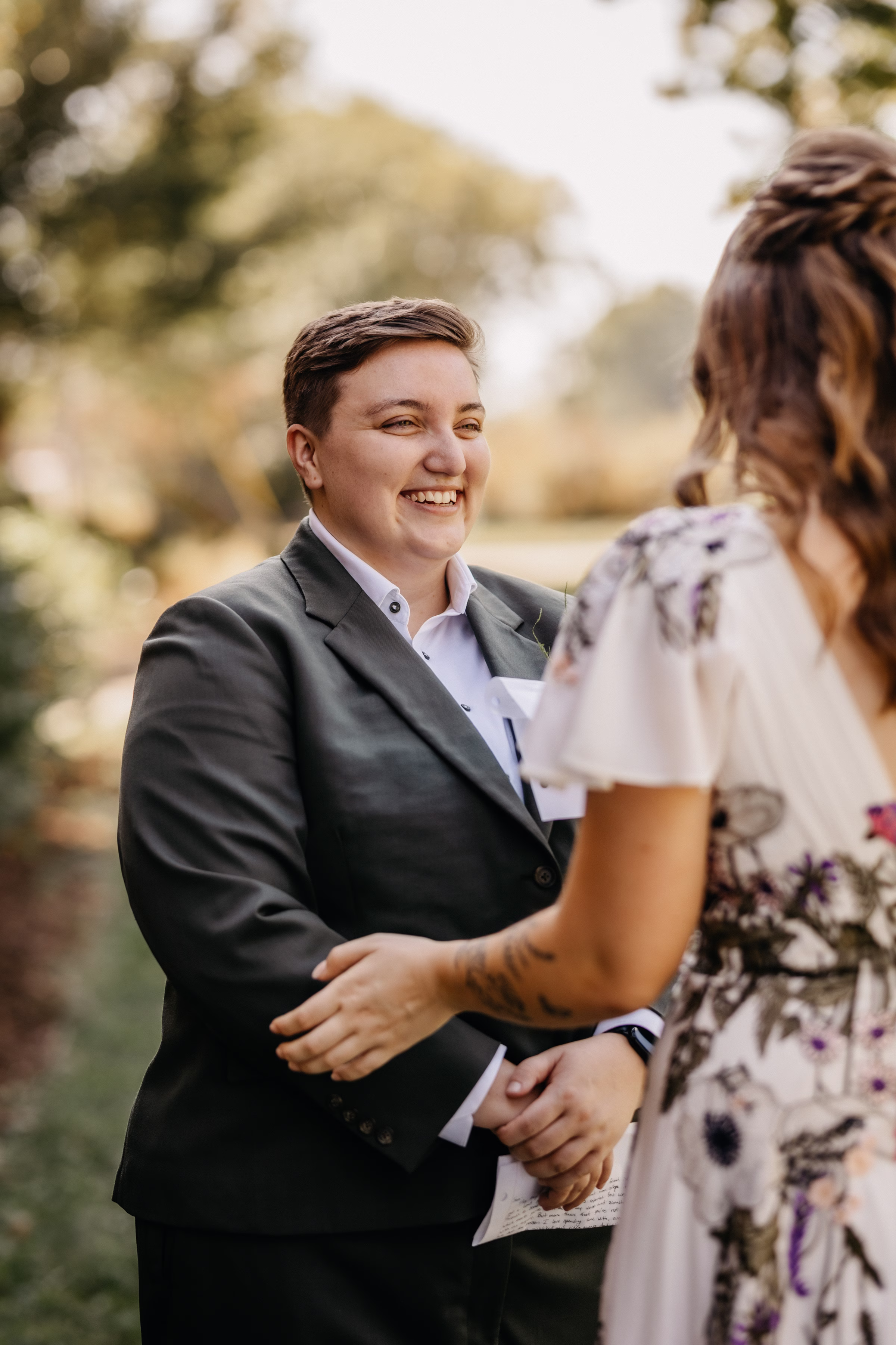 a bride smiles at her partner during a wedding day first-look