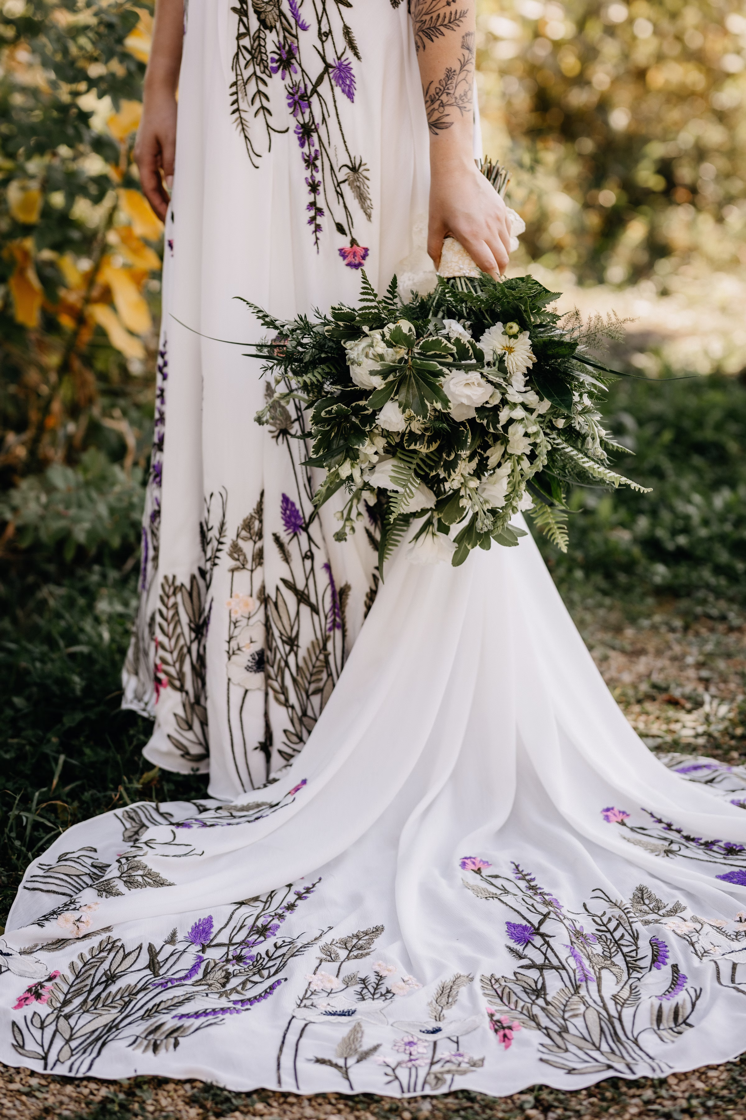 a detail shot of Sam's colorful wedding dress and her bouquet