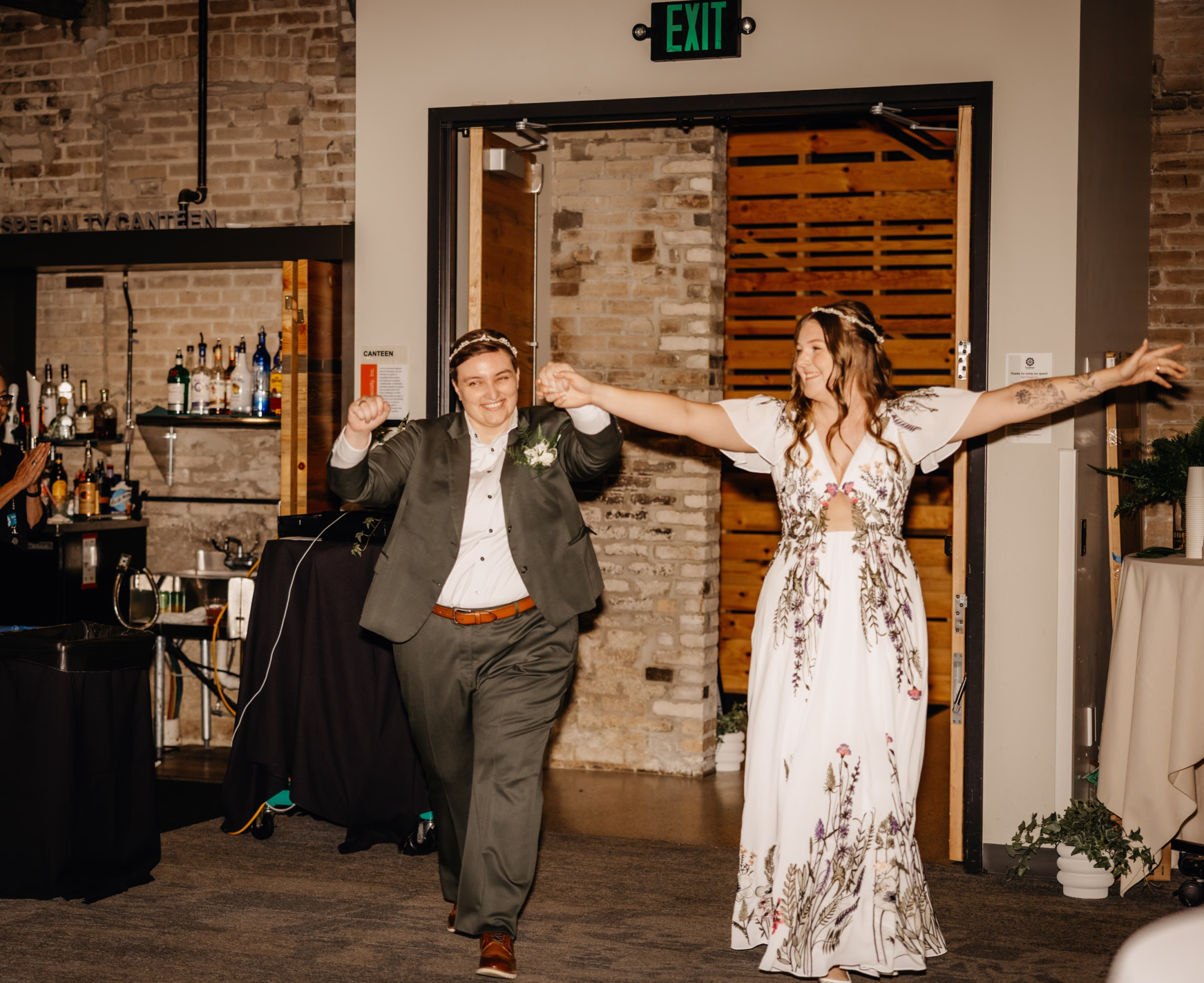 the brides arrive at their wedding reception at Goodman Community Center in Madison, Wisconsin