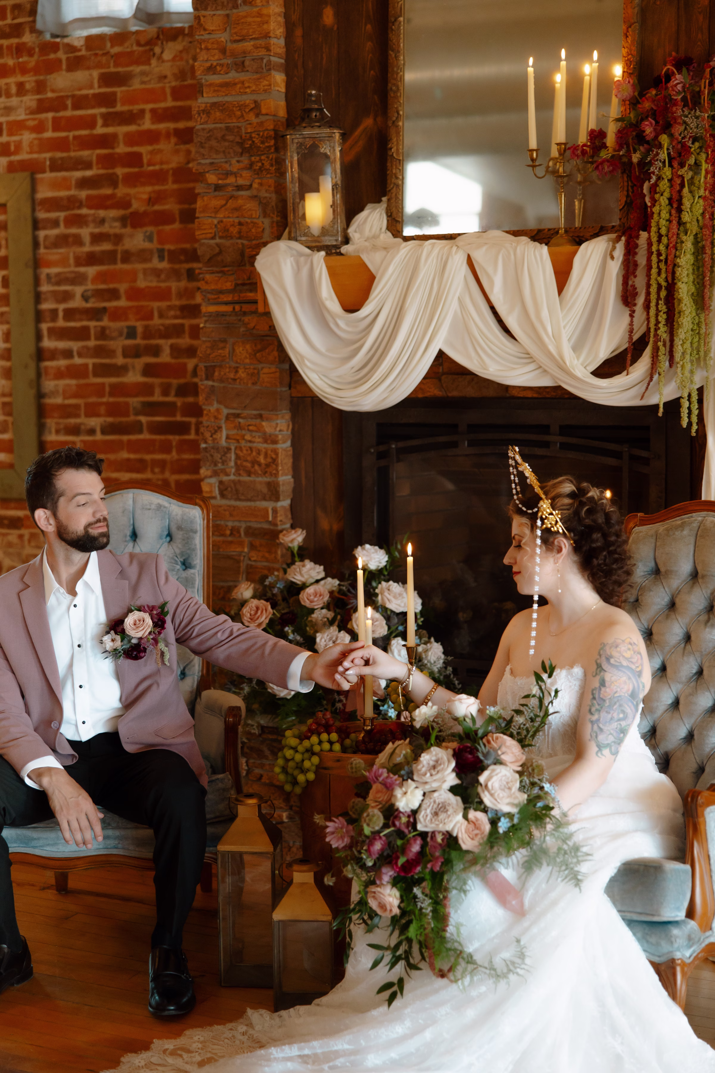 a bride and groom hold hands while seated in the lounge