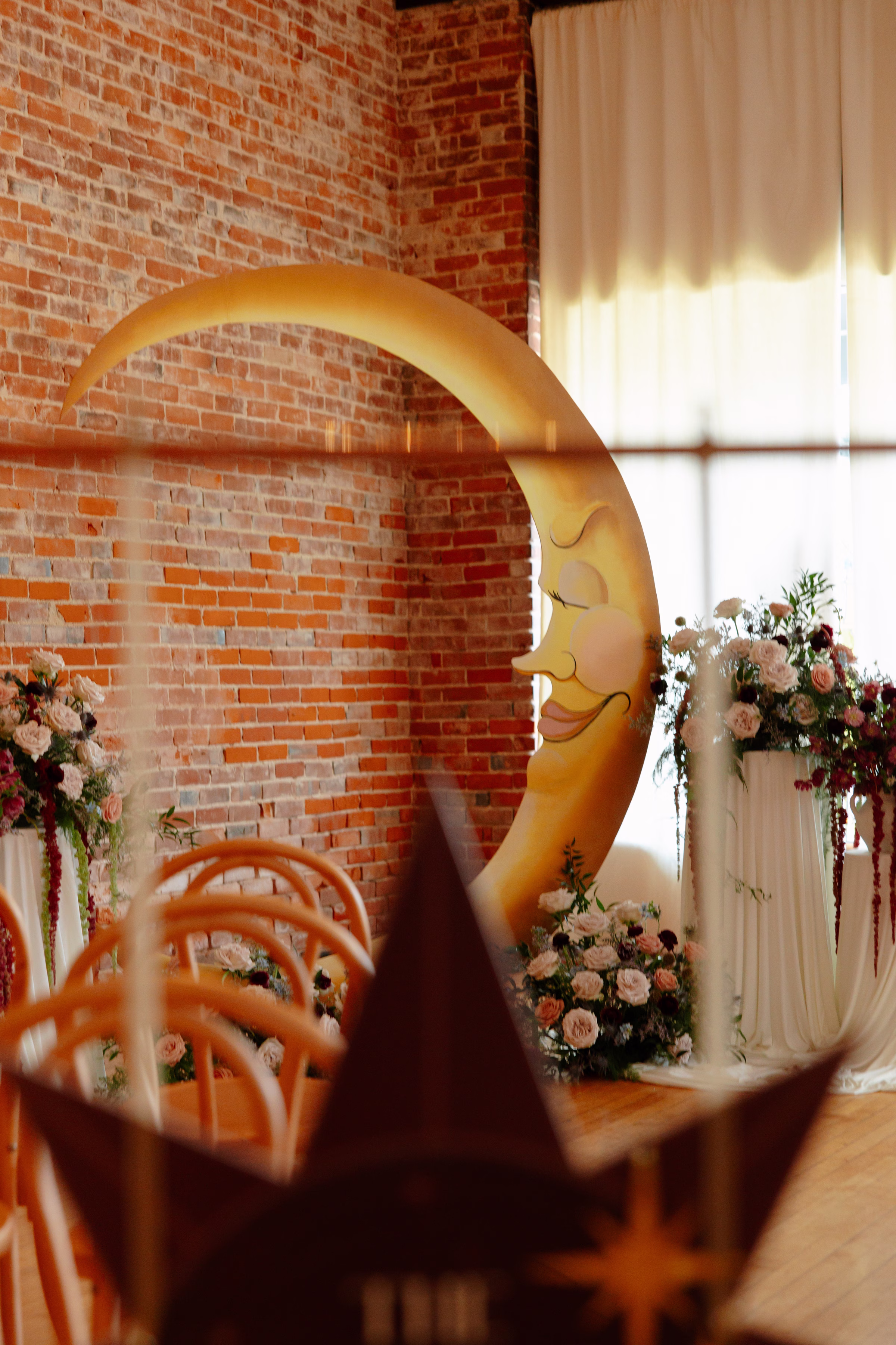 a paper moon celestial wedding ceremony backdrop in West Salem, Wisconsin