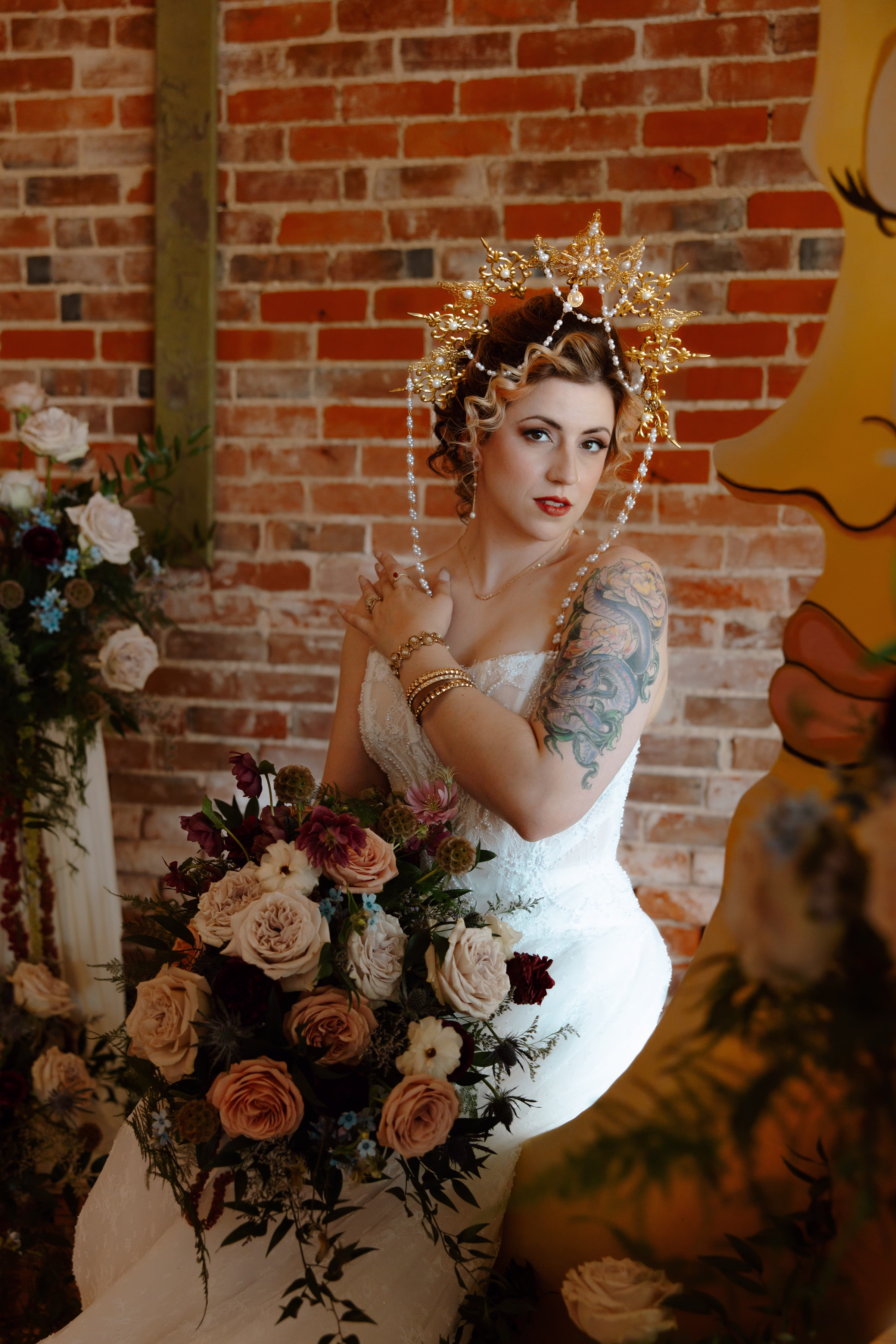 the bride holds her bouquet at the ceremony