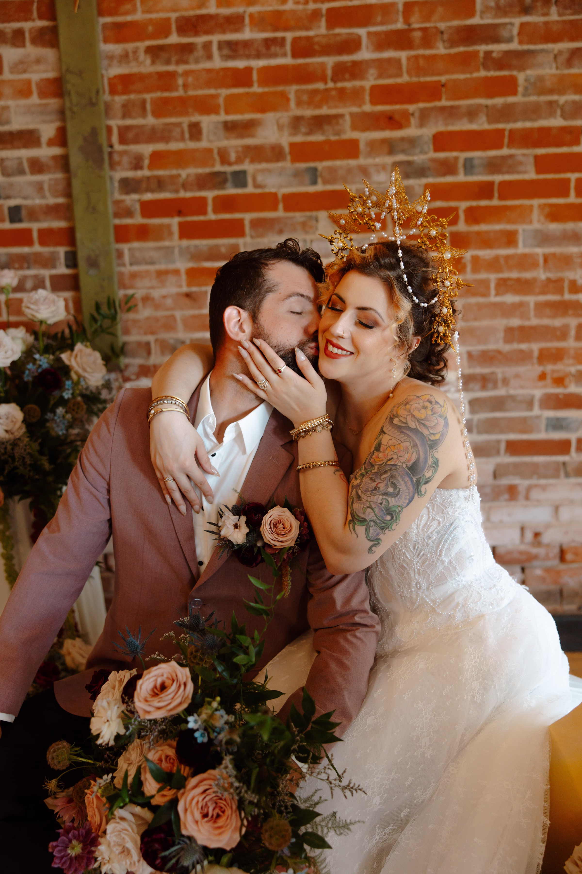 the bride and groom embrace