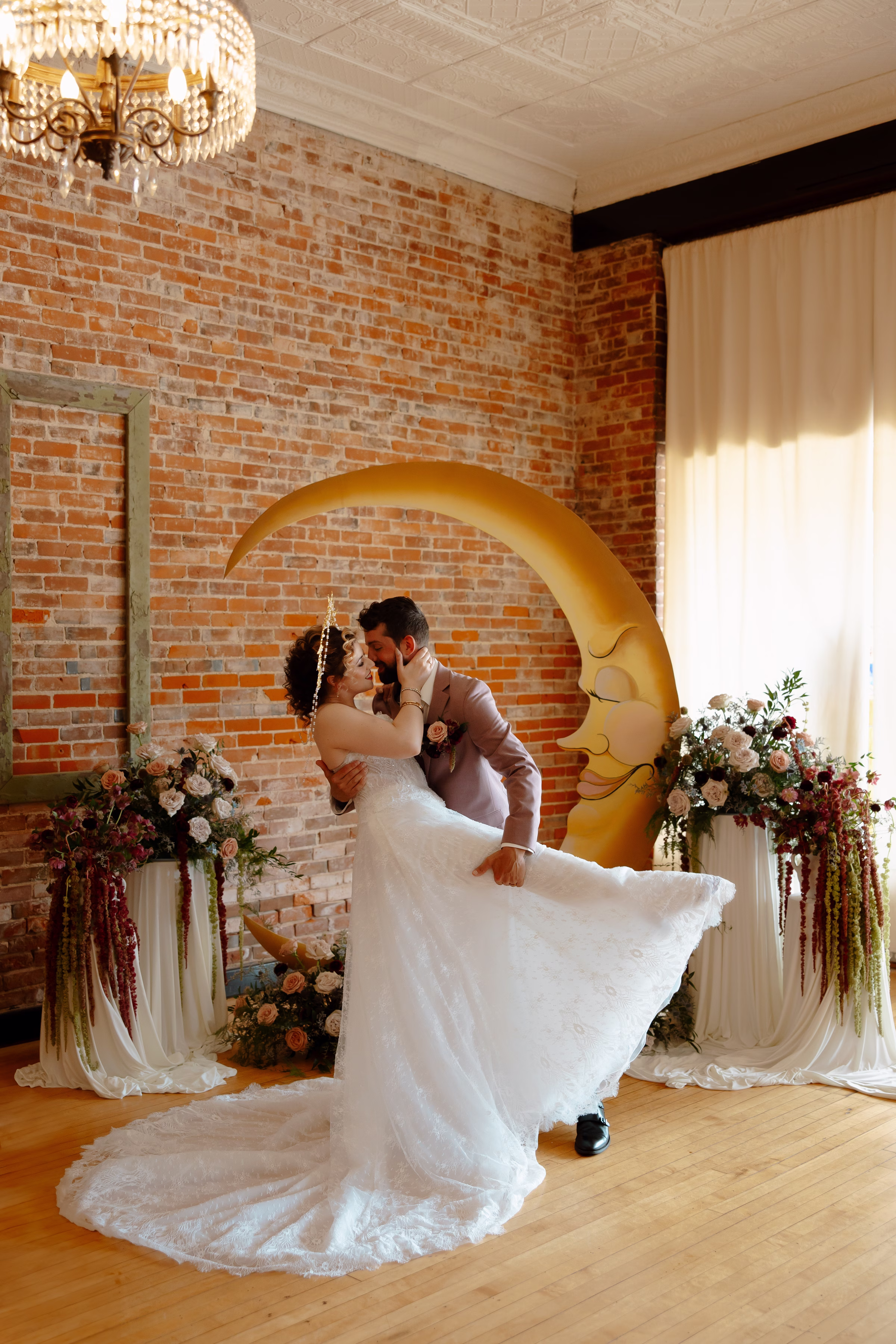 the couple shares a kiss at the ceremony