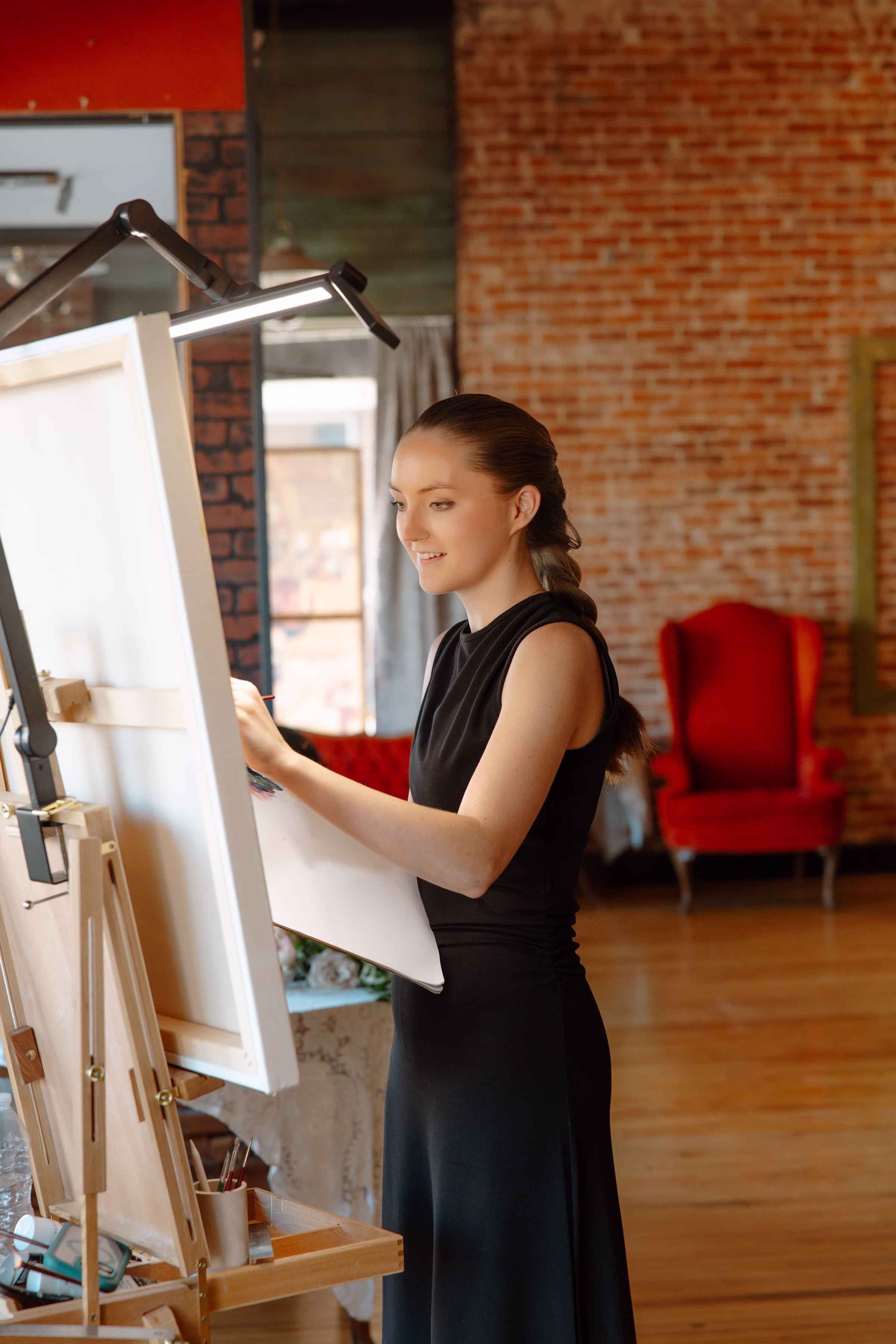 Live wedding painter, The Artist Brenda Berg, paints at B's Place Event Venue in West Salem, Wisconsin