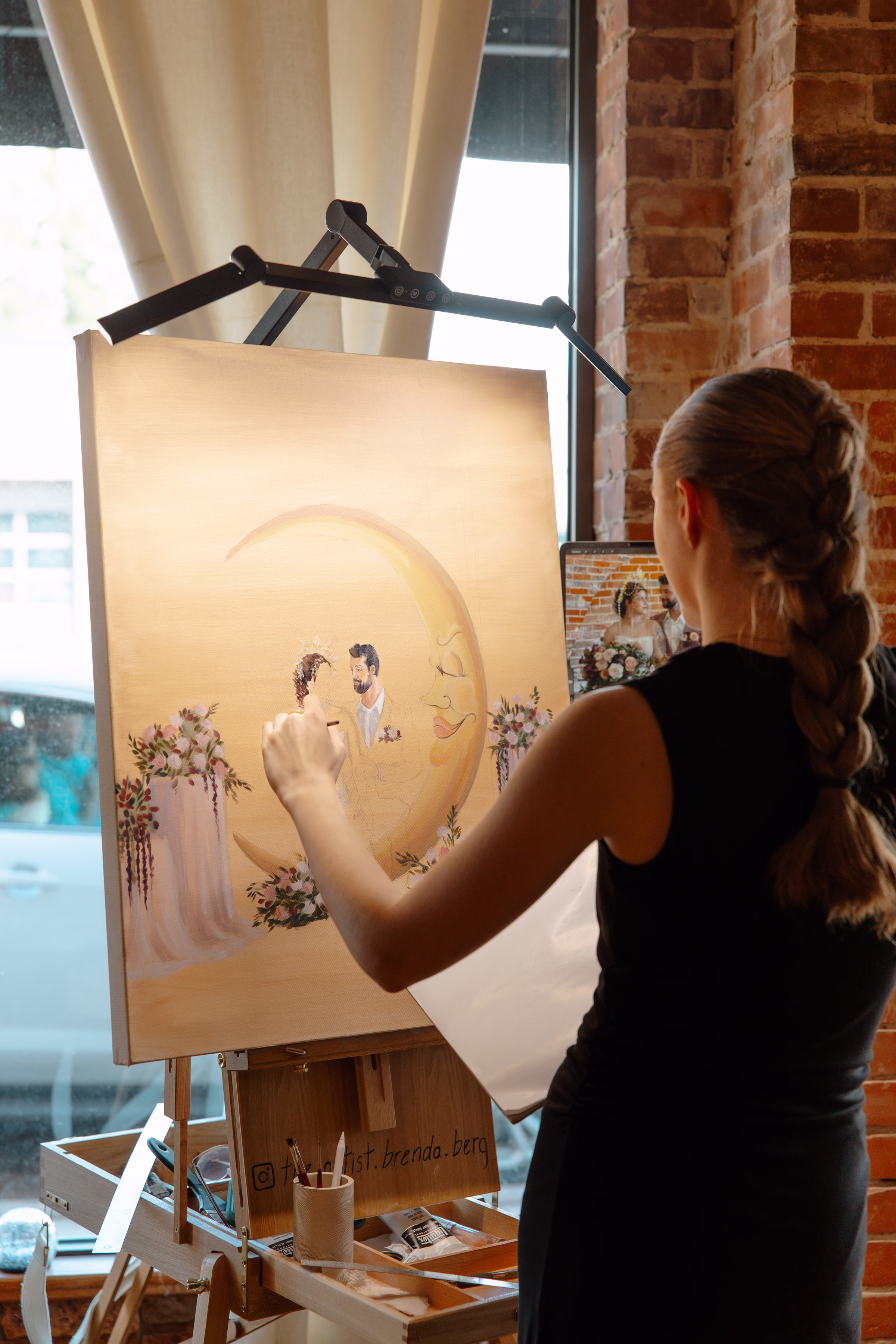 Live wedding painter, The Artist Brenda Berg, paints the Midsummer Dream celestial wedding ceremony scene at B's Place Event Venue in West Salem, Wisconsin