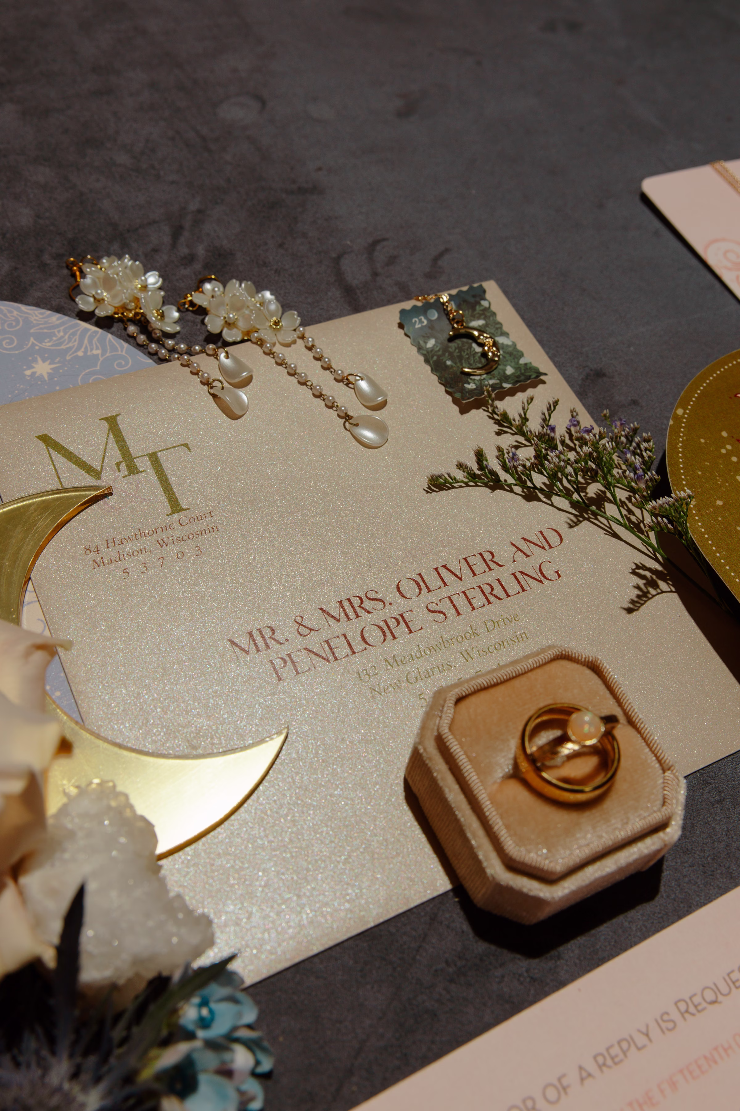 celestial inspired, contour-cut wedding stationery pieces by LK Bridal Studio in blush, orange, gold, and dusty blue