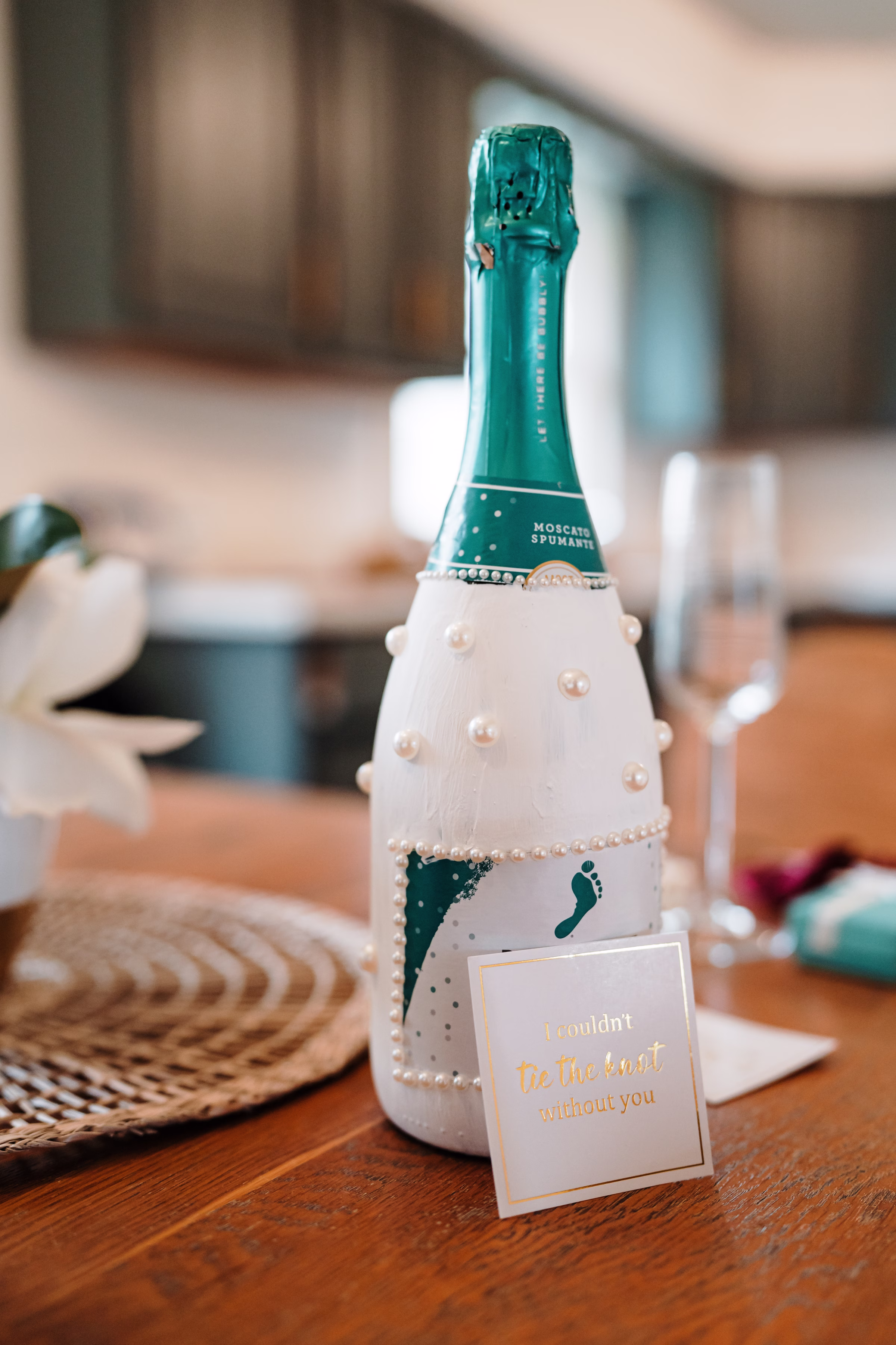 scenic fall wedding winnebago springs minnesota getting ready 3458 - An Elegant Fall Wedding at Winnebago Springs | Emma & Tyler a detail photo showing a painted bottle of Barefoot Wine that has been customized for a wedding day